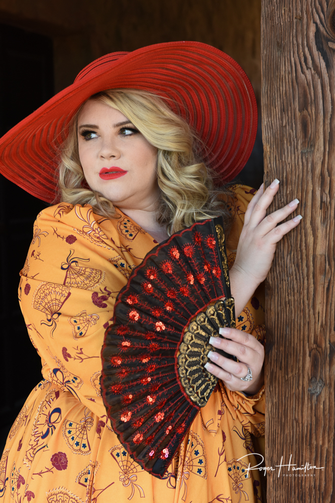 Danielle in pin-up attire at the Mission San Juan Capistrano